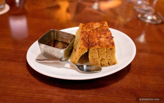 The Foccaccia Bread with a Pomegranate Dipping Sauce is brought to the table shortly after your server has taken drink orders and reviewed any changes or questions about the menu.