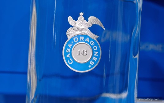 A closer look at the logo on a bottle of Casa Dragones Tequila.