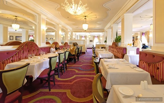 The non-window seating rows feature side-saddle half-booths. All the tables are used at the Parisian Lunch, as the event is usually sold out in advance.