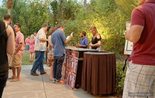 A typical beer tasting station includes signage and additional information about the beers being offered.