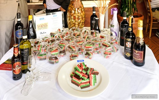 It's the take-away table! Unfortunately, the bottles are not one of the take-aways... those are for display purposes only. What you do get as a parting gift, is a small sample of red, white, and green cake with a thin layer of berry compote between the layers!