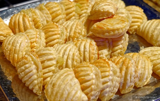 Various fruit filled pastries are available for a lighter take on dessert. Here, a tray of apple filled puffs are ready to go.