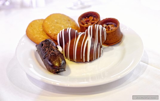 Other desserts at the Epcot New Year's Eve Dining Event include no-sugar
 added lemon cookies, pecan chocolate tarts, chocolate mini-éclairs, and
 a chocolate Mickey dome with white chocolate stripes.