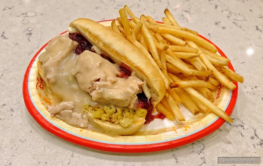 The Holiday Special Turkey and Stuffing Sandwich was served warm with a side of fries. The red stuff in the sandwich is cranberry sauce.