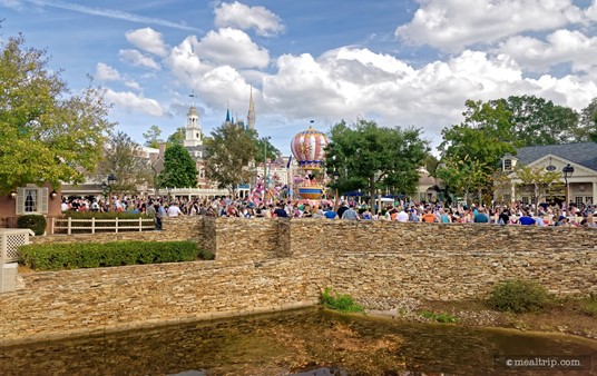 Looking back at the tail end of the Festival of Fantasy Parade as it rounds the corner and moves past the Hall of Presidents. This was taken on the top level of the Liberty Square Riverboat.