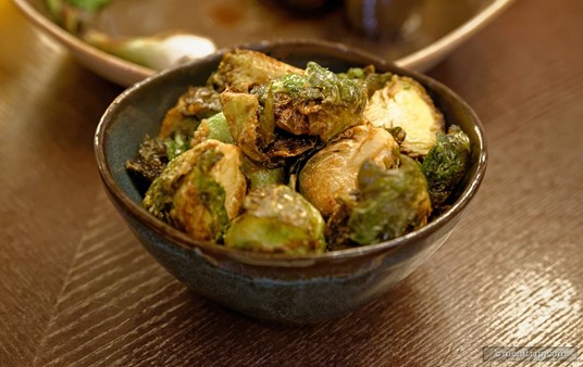 A popular side item at Artist Point are the Crispy Brussels Sprouts featuring a Fermented Bean Vinaigrette glaze.