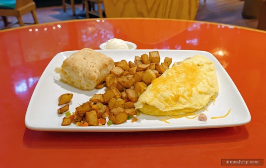 Ham and Cheddar Omelette which is served with Country Potatoes and a House-made Buttermilk Cheddar Biscuit.