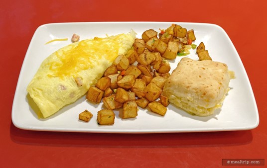 Ham and Cheddar Omelette which is served with Country Potatoes and a House-made Buttermilk Cheddar Biscuit.