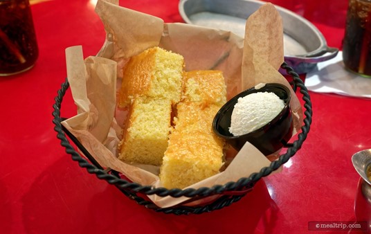 A bastket of fresh cornbread and honey butter are "Starters" that are served with any of the All-You-Care-To-Enjoy Skillets at the Whispering Canyon Cafe.