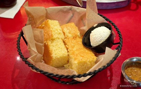 This is the initial portion of cornbread and honey butter that was brought to the table for two people. As far as I know, the cornbread is also "all you care to enjoy", so if you would like more... just ask!