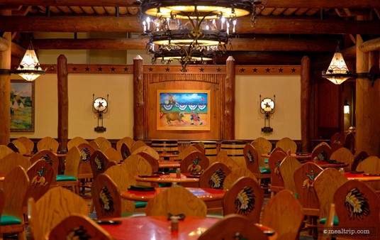 Here's a great shot of one of the Rodeo paintings that's on the back wall at the Whispering Canyon Cafe. Notice all those cowboy and Indian prints on the backs of the chairs? I think they really help define the toy box feel of this classic Disney restaurant.