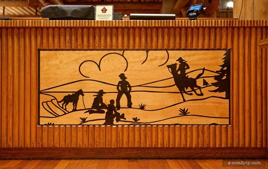 There are a lot of cool "old west" design elements all around the Whispering Canyon Cafe. This cowboy scene is part of the check-in desk.