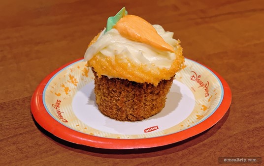 Once you get the wrapper off, it's easier to see that there is some 
Carrot Cake under that cream cheese-like icing. The Carrot Cake Cupcake 
is not exclusive to Roaring Fork. They can be found at other Disney 
locations depending on the bakery schedule. (photo circa 2016, historical reference)