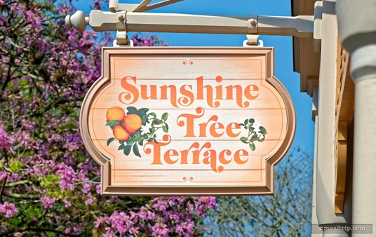 The Sunshine Tree Terrace Sign hangs over the building.