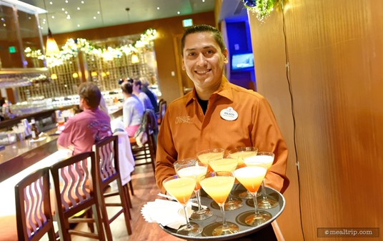 Wilson brings out a tray of Bay Lake Sunset cocktails.