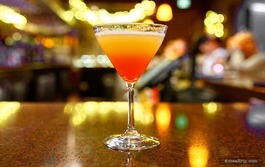 The featured beverage at the "first course stop" is a Bay Lake Sunset, which is generally only available to guests that have access to the exclusive Top of the World Lounge in the Bay Lake Tower complex.