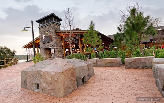 There is a fire pit and some stone-wall type seating around the fire pit on the walkway leading up to the Geyser Point Bar and Grill.