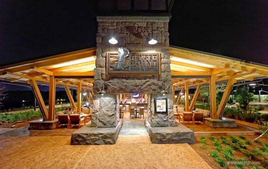 The main entrance to the Geyser Point Bar and Grill Lounge at night.