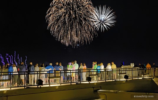 Both observation decks offer amazing views of the fireworks. For this photo, I am standing very close to the door that leads back into the event space. If you walk out a bit further, you will see more of the park below the fireworks.