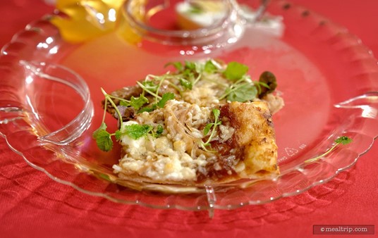 A closer look at the Duck Confit Flatbread with Red Onion Jam, Laura Chenel Goat Cheese and Candied Pecans.