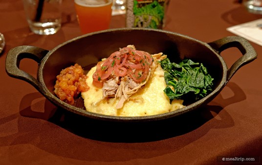A closer look at the Whole Roasted Pig course features Creamy Pancetta Grits, Collard Greens, Pickled Red Onions and Cranberry-Pineapple Chutney.