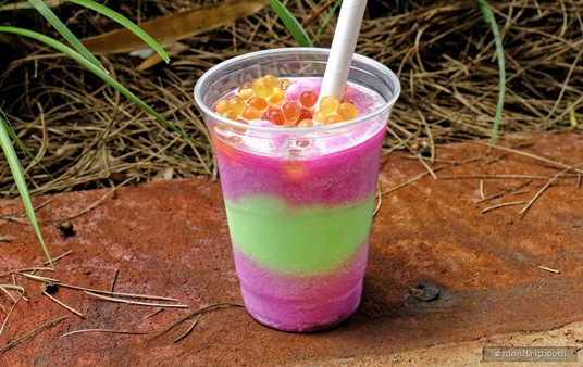 The "Night Blossom" is a three layer frozen mix of Desert Pear (cactus), Limeade, and Apple. The non-alcoholic beverage is topped with passion fruit flavored boba pearls.