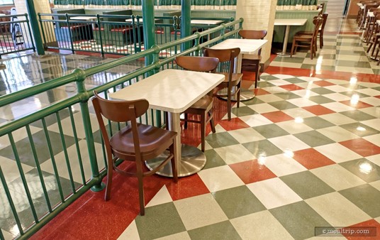 Here's a cute little two top really close to the stairs at PizzeRizzo. The have smartly put up a railing around the back side of the open staircase, keeping guests out of that area.