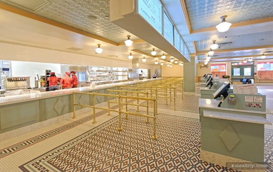 Moving closer to the food pick-up area, there are little brass guide rails in place... presumably to keep guests from shifting too far left or right from the register that their meal was purchased at.