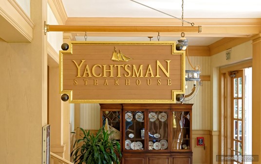 The Yachtsman Steakhouse sign hangs over the main entrance in a hallway of sorts.