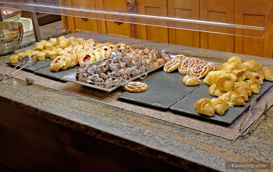 There's also an assorted baked goods table, offering apple turnovers, lingonberry muffins, cherry danishes and croissants. (It's looks like one chocolate doughnut bit is trying to leave the table in this shot.)