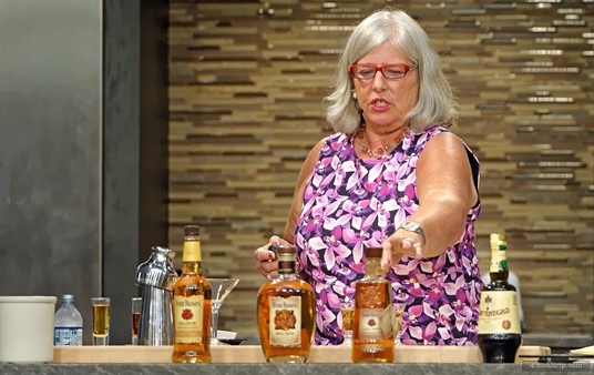 Cile Moreno leads an interactive Four Roses Bourbon tasting and Manhattan making session for Epcot's Mix It, Make It, demo series.