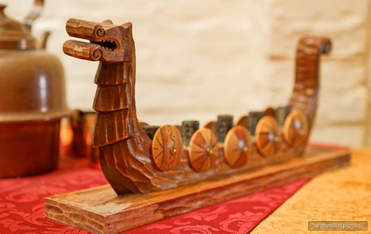 This is a model of a traditional Viking longboat (possibly the Draken boat). I'm sure at one point, it could have been used to hold straws or even cheese. Now, it's a decoration near the salad prep area.