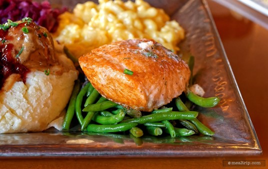 The Herbed Butter Grilled Salmon at Akershus is served on top of some green beans!