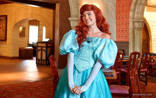 Ariel from "The Little Mermaid" meets with guests at Epcot's Akershus Royal Banquet Hall. (Clearly, she has feet and not a flipper at the moment.)