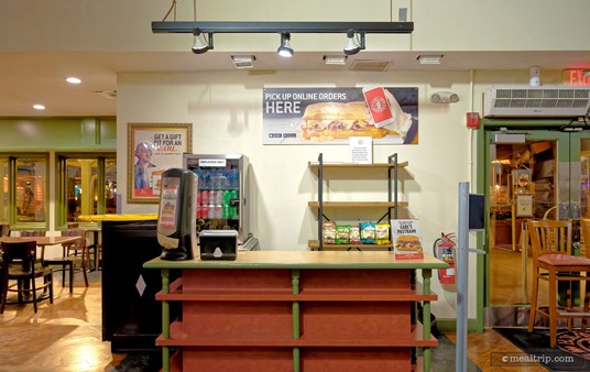 Hummmm... I can't say as though I've ever seen anyone behind this counter. The sign on the wall suggests this might be an online order pickup area. Interesting.