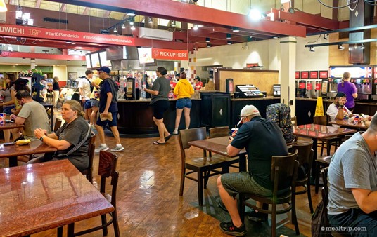 After you pick up your food order under the "Pick Up Here" sign, you can get your own drinks and napkins, etc. from the stations on the right.