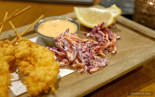 There's a small amount of purple cabbage slaw, which adds a nice, colorful touch to the serving board. Fear not the sweet chili aioli... it's more aioli, than sweet chili.