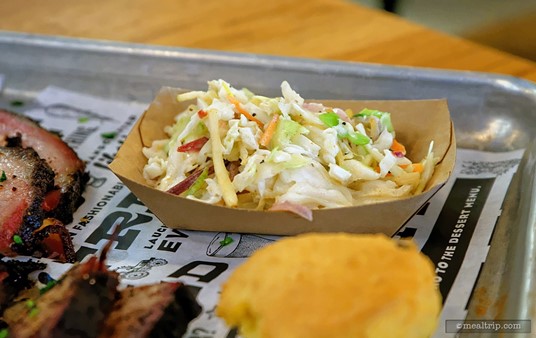 I think the Signature Polite Slaw comes with most of the "From the Smoker" entrées at the Polite Pig. It's a nice extra... not too tangy and not too vinegar heavy either. Just a nice cool slaw.