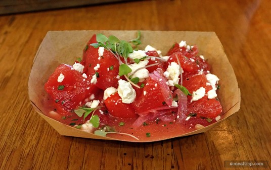 This 
                Tomato and Watermelon Salad                with Feta, Basil and Pickled Onion is one of the "Market Sides" at the Polite Pig at Disney Springs.