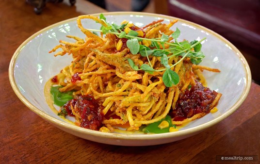 The red stuff in Raglan's "Sure I'm Frittered" dish is a fire roasted pepper relish. The item is listed as a appetizer or starter — which on the Raglan Menu is called the "It's All to Savor" section.