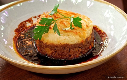 Oh I know what you're thinking... that red wine au jus is a sloppy mess — but see how it's clinging to the sides of the dish? Those bits are actually starting to caramelize on the side of the bowl because it's so hot when it's delivered to your table — and those caramelized bits are the best. Scrape those off the side with your fork — there's something special about braised beef, lamb, and red wine au jus when it starts to caramelize into a solid.