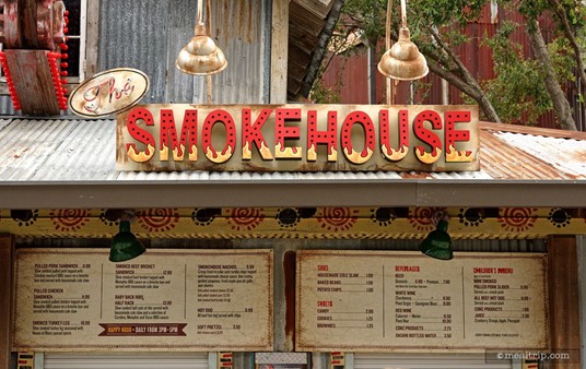 The Smokehouse sign above the menu board, which is above the order and pickup window!