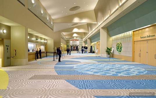 Looking east down the lobby hall of the Fantasia Ballroom event space. The check-in desks are on the left and the doors leading into the Countdown to Midnight New Year's Eve event are on the right.