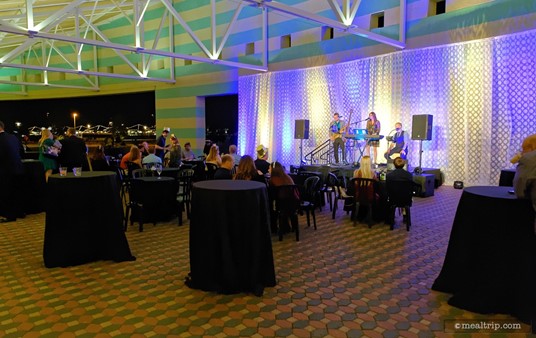 There are a few tables set up outside under the Porte Cochère. These are not assigned and are open to anyone that's attending the event... however... it is quite a walk back to the food and beverages in the main room.