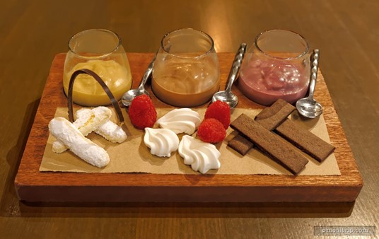 The Trio of Puddings from the Ale and Compass dinner menu includes "pairings" for each pudding — lady fingers, baked meringue, and chocolate wafers. The pussings from left to 
right, Butterscotch, Chocolate, and Blackberry Pudding.