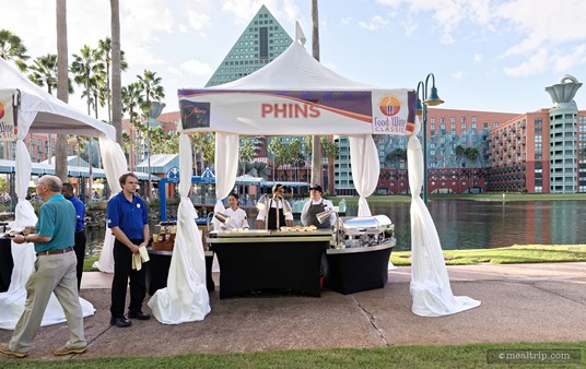 There are a few food and beverage kiosks located between the main causeway and the Beer Garden area (along the walkway that eventually leads to Epcot), like this Phins food kiosk in 2018.