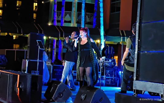 The main stage band plays at various times throughout the night! They're located at the end of the main causeway, closest to the Dolphin building. (2018)