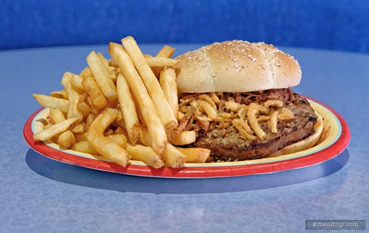 The French Dip Burger at the Electric Umbrella combines an Angus Burger, Beef Brisket, Crispy Onions, and Muenster cheese.