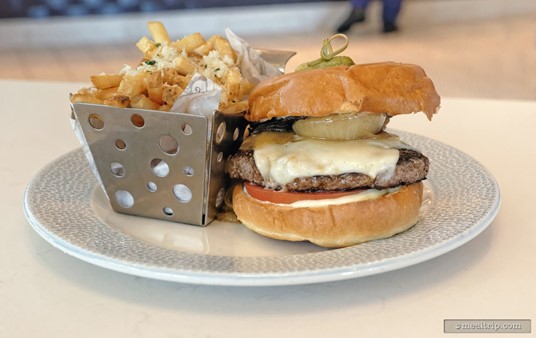 The Riviera Burger features a grilled portobello top, swiss 
cheese, caramelized onions and a tomato, all between a brioche roll. 
It's served with a side of fries that have been dusted with parmesan 
cheese and herbs.