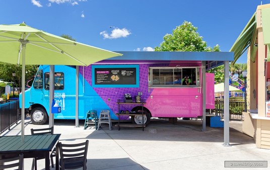 The blue, purple and pink truck is the main food truck in the area that is open. The "Yummy Yummy Nom Noms" truck offers a couple different grill cheese and chicken tender meals.